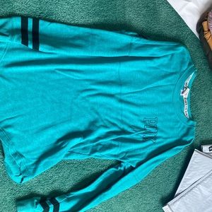 Teal “jersey” style shirt